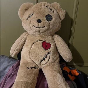 Spencer's Brokenhearted Teddy Bear plush Backpack with Heart Patch and stitches